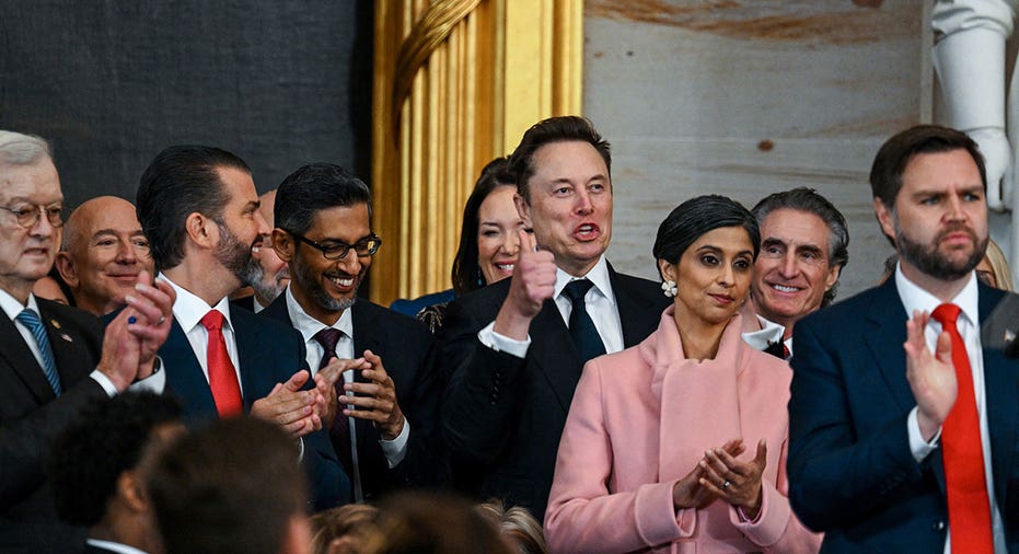 Jeff Bezos, Donald Trump Jr., Sundar Pichai, Elon Musk, Usha Vance, Doug Burgum and Vice President JD Vance applaud during the inauguration of Donald Trump as the 47th president of the United States takes place inside the Capitol Rotunda of the U.S. Capitol building in Washington, D.C., Monday, January 20, 2025. It is the 60th U.S. presidential inauguration and the second non-consecutive inauguration of Trump as U.S. president. Kenny Holston/Pool via REUTERS