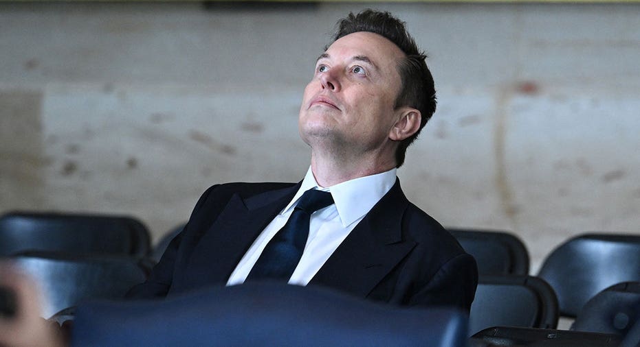 Tesla and SpaceX CEO Elon Musk takes his seat at the inauguration ceremony before Donald Trump is sworn in as the 47th US President in the US Capitol Rotunda in Washington, DC, on January 20, 2025. Saul Loeb/Pool/AFP via Getty Images