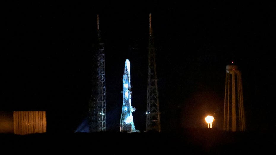 A Blue Origin New Glenn rocket stands ready during its launch attempt.