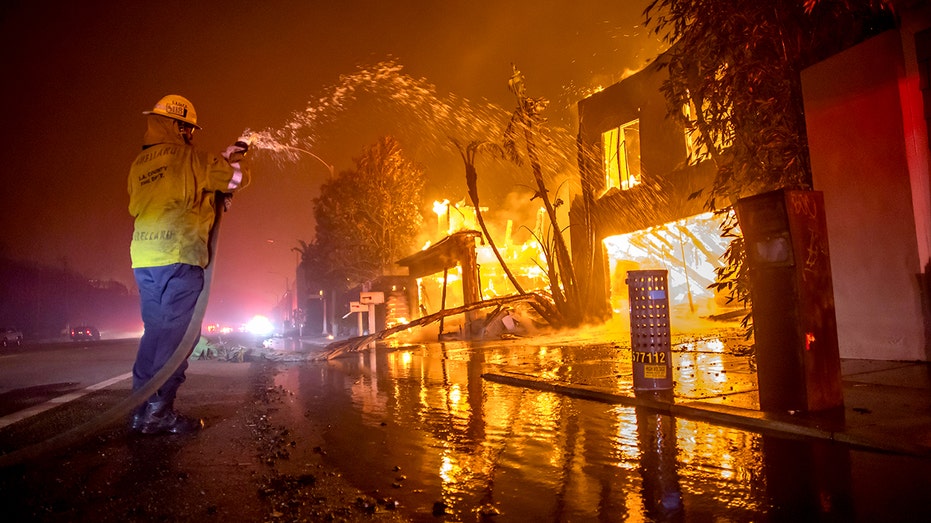 Firefighters battle the Palisades fire.