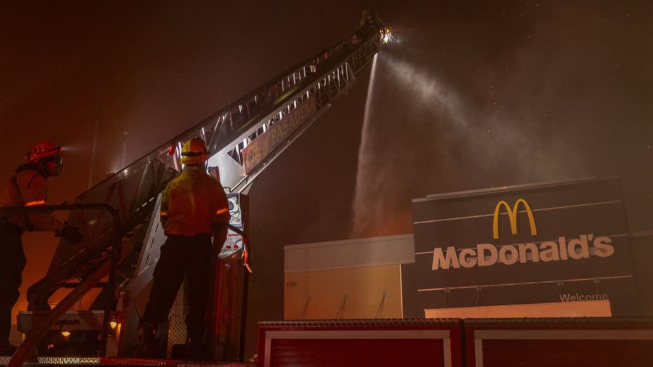 PASADENA, CALIFORNIA - JANUARY 7: Firefighters battle the Eaton fire as a McDonald's fast food restaurant burns in Pasadena, California on January 7, 2025. A powerful Santa Ana wind event has dramatically increased the risk of wind-driven wildfires like the Santa The dangerous and destructive Palisades near Monica The high winds also forced President Joe Biden to cancel his plans to travel between Los Angeles and Riverside, Calif. (Photo by David McNew/Getty Images)