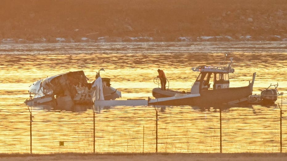 Part of the wreckage is considered to be rescue boats excavating the waters of the Potomac river after an airplane as Reagan National Airport has crashed in the river near Washington, DC, the January 30, 2025.