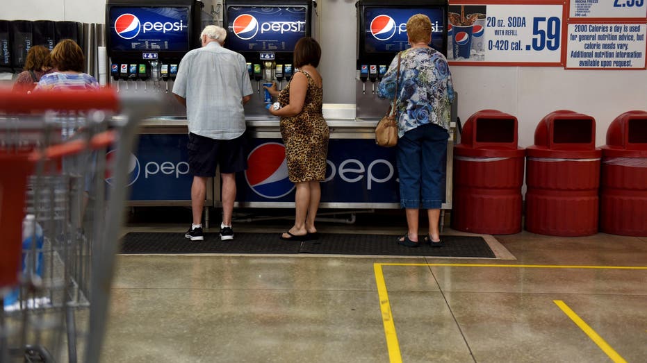 Costco customers filling soda at costco