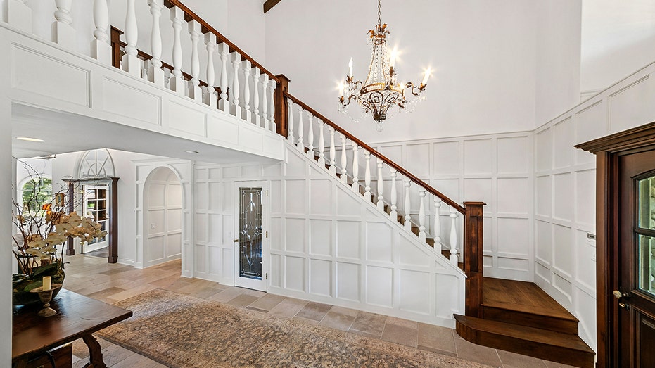 Upon entry, guests are greeted with a grand dual-level foyer.