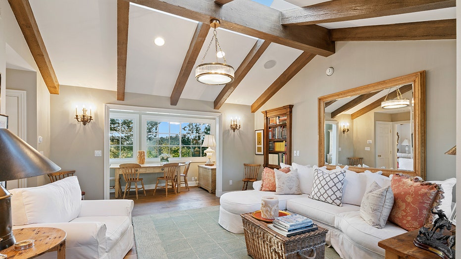 Another highlight of the home is a casual living space with a skylight and built-in bookshelves.