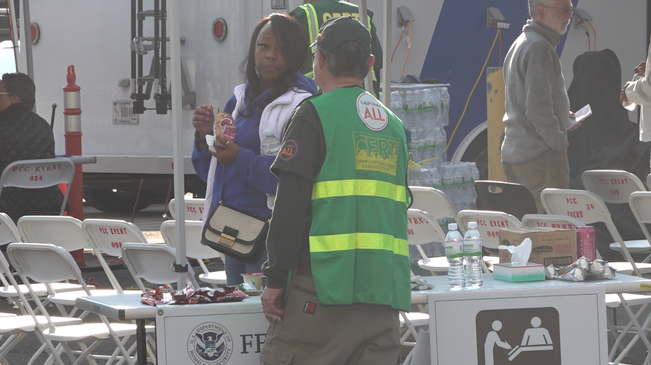 People at the FEMA Disaster Recovery Center chatting.