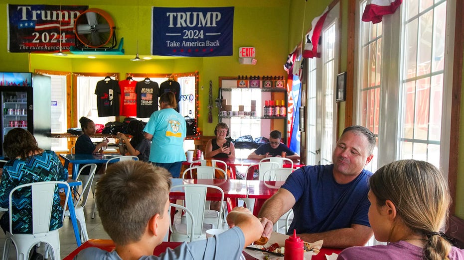 People eating a Trump Burger restaurant