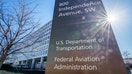 WASHINGTON, DC - FEBRUARY 09: The sun flares next to the sign marking the location of the Federal Aviation Administration (FAA) headquarters on February 9, 2024, in Washington, DC. (Photo by J. David Ake/Getty Images)