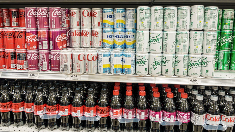 Cans and bottles of Coca Cola products in a Florida grocery store