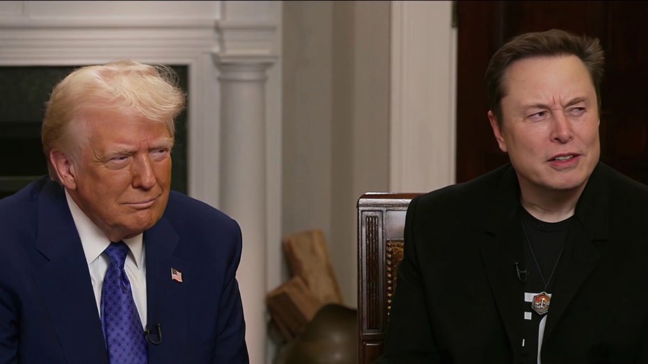 Donald Trump and Elon Musk sit together