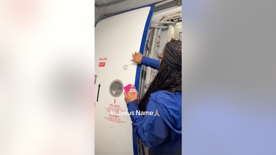 Florida's wife blesses the jetblue plane before takeoff