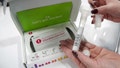 A company representative shows off what is in a DNA kit at the 23andMe booth at the RootsTech annual genealogical event in Salt Lake City, Utah, U.S., February 28, 2019. - Fox News