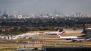 LONDON, ENGLAND - OCTOBER 11: A general view of aircraft at Heathrow Airport in front of the London skyline on October 11, 2016 in London, England. The UK government has said it will announce a decision on airport expansion soon. Proposals include either a third runway at Heathrow, an extension of a runway at the airport or a new runway at Gatwick Airport. (Photo by Jack Taylor/Getty Images)