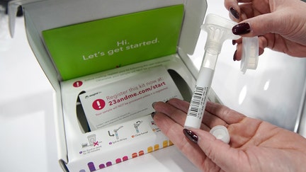 A company representative shows off what is in a DNA kit at the 23andMe booth at the RootsTech annual genealogical event in Salt Lake City, Utah, U.S., February 28, 2019.
