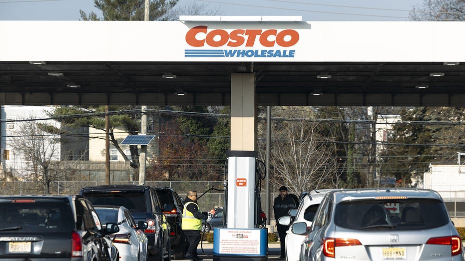 Cars line up at a Costco gas station in Bayonne, New Jersey, US, on Saturday, Dec. 9, 2023. Costco Wholesale Corp. is scheduled to release earnings figures on December 14. Photographer: Angus Mordant/Bloomberg via Getty Images