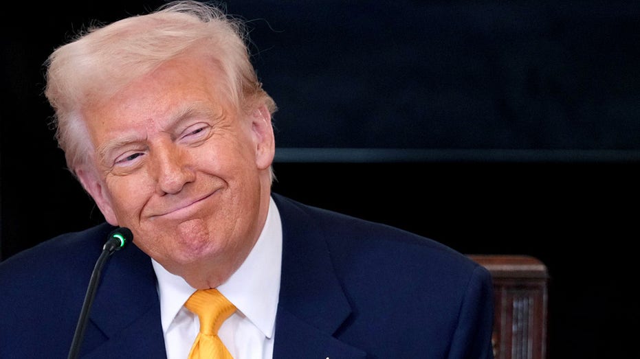 Trump smiles at White House digital assets summit