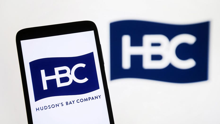 UKRAINE - 2024/08/12: In this photo illustration, a Hudson's Bay Company (HBC) logo is seen on a smartphone and on a pc screen. (Photo Illustration by Pavlo Gonchar/SOPA Images/LightRocket via Getty Images)