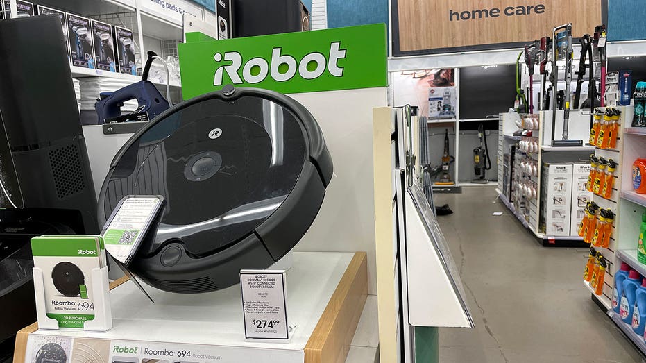 Roomba robot vacuums made by iRobot are displayed on a shelf at a Bed Bath and Beyond store