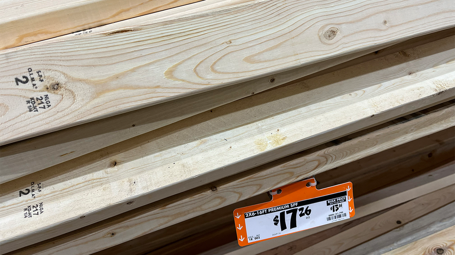 A stack of lumber with price tag.