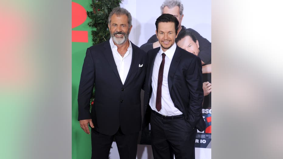 Mark Wahlberg and Mel Gibson at a premiere