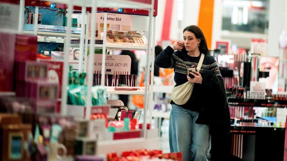 A woman looks at beauty products in a local store in New York City on Dec. 10, 2023.