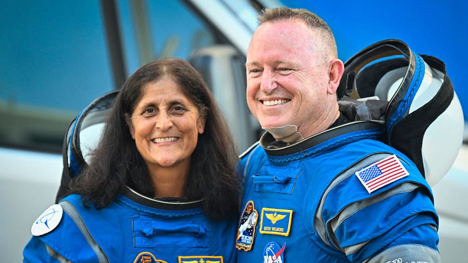 NASA astronauts Butch Wilmore (R) and Suni Williams, wearing Boeing spacesuits, depart the Neil A. Armstrong Operations and Checkout Building at Kennedy Space Center for Launch Complex 41 at Cape Canaveral Space Force Station in Florida to board the Boeing CST-100 Starliner spacecraft for the Crew Flight Test launch , on June 5, 2024. Boeing on June 5 will try once more to launch astronauts aboard a Starliner capsule bound for the International Space Station. Liftoff is targeted for 10:52 am (1452 GMT) for a roughly one-week stay at the orbital laboratory. (Photo by Miguel J. Rodriguez Carrillo / AFP) (Photo by MIGUEL J. RODRIGUEZ CARRILLO/AFP via Getty Images)