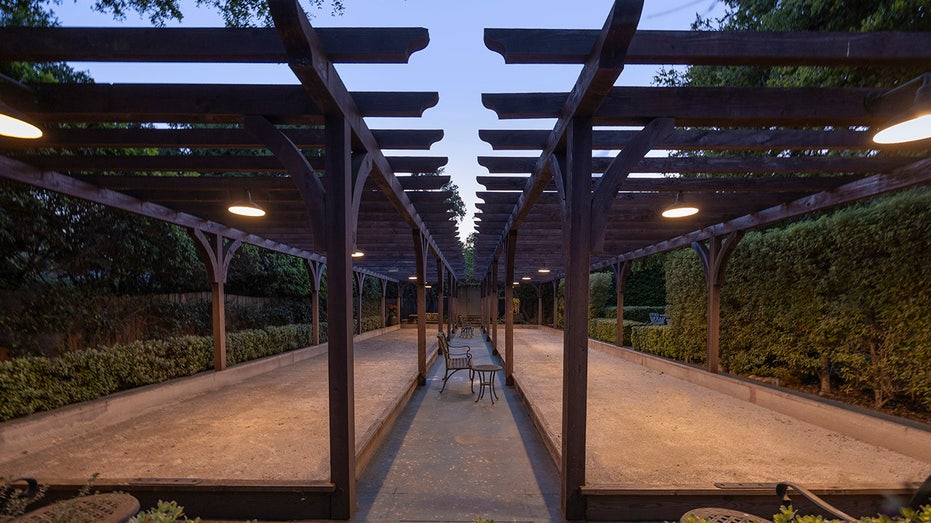 The backyard also includes bocce ball courts.
