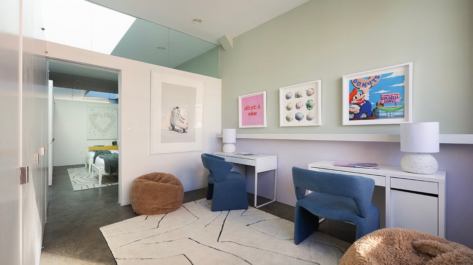 One of the bedrooms is currently furnished as a study area with desks and bean bag chairs.