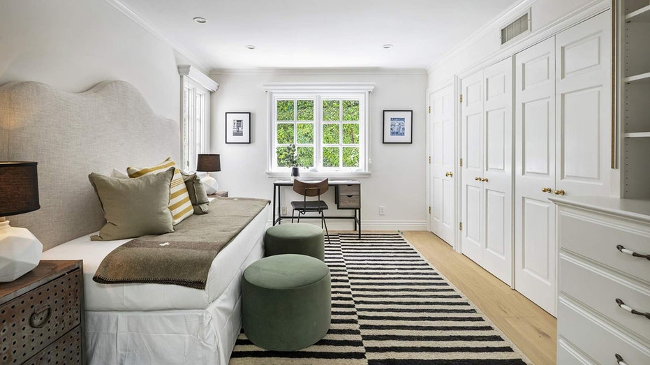 A guest bedroom with a large closet can also be used as an office.
