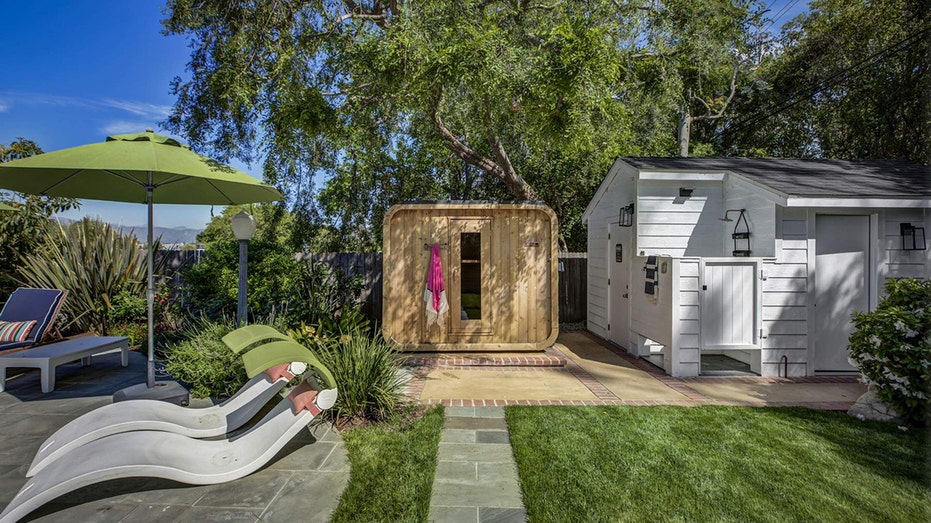 The backyard also features a sauna and a private outdoor shower.