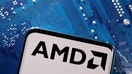 A smartphone with a displayed AMD logo is placed on a computer motherboard in this illustration taken March 6, 2023.