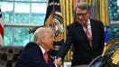 US President Donald Trump shakes hands with British ambassador to the United States Peter Mandelson after making a trade announcement in the Oval Office of the White House in Washington, DC, on May 8, 2025. US President Donald Trump on Thursday announced a &quot;full and comprehensive&quot; trade agreement with Britain, which would be the first such deal since he launched his global tariffs blitz.