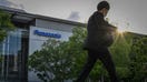 A man walks past the Panasonic Centre in Tokyo on May 9, 2024. (Photo by Yuichi YAMAZAKI / AFP) (Photo by YUICHI YAMAZAKI/AFP via Getty Images)
