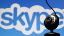 A web camera is seen in front of a Skype logo in this photo illustration taken in Zenica, May 26, 2015.