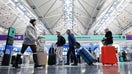 Travelers walk through O&apos;Hare International Airport in Chicago, Illinois, on November 22, 2024, ahead of the upcoming Thanksgiving holiday. (Photo by KAMIL KRZACZYNSKI / AFP) (Photo by KAMIL KRZACZYNSKI/AFP via Getty Images)