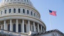 A US flag flies near the dome of the US Capitol in Washington, DC, February 25, 2025. 