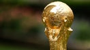 Jun 16, 2022; New York, New York, USA; A detail view of The FIFA World Cup Trophy sits on a stand outside of 30 Rockefeller Plaza.  - Fox Business News