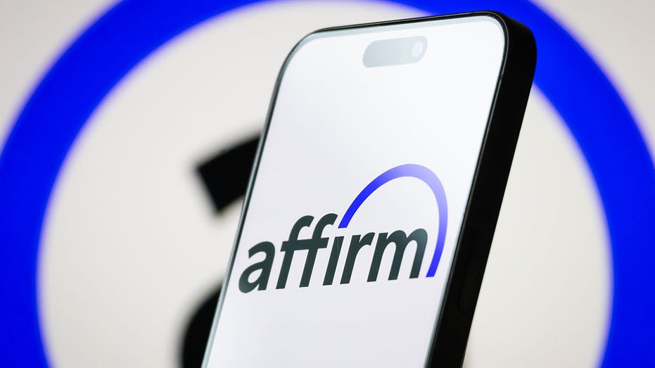 CHONGQING, CHINA - MAY 06: In this photo illustration, the logo of Affirm Holdings, Inc. is displayed on a smartphone screen, with the company's blue-accented branding visible in the background, on May 06, 2025, in Chongqing, China. Affirm is an American financial technology company that offers buy now, pay later (BNPL) services, allowing consumers to make purchases and pay over time with transparent and simple financing. (Photo illustration by Cheng Xin/Getty Images)