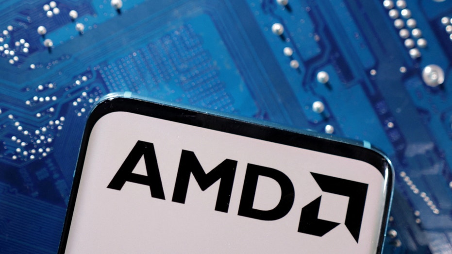 A smartphone with a displayed AMD logo is placed on a computer motherboard in this illustration taken March 6, 2023.