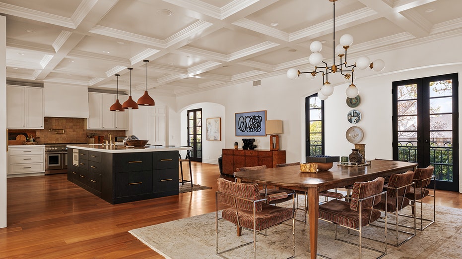 Connected to the kitchen is the formal dining room, with a table large enough for eight guests.