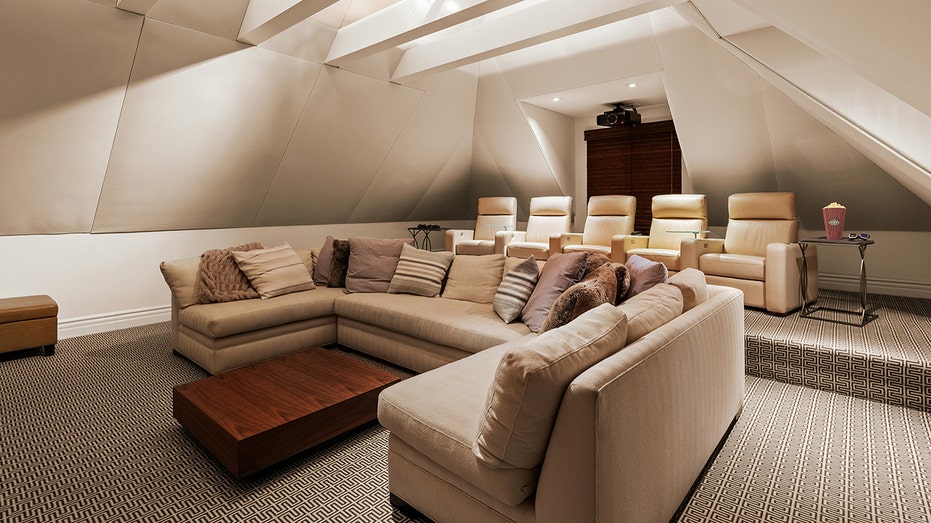 A home theater can be found above the three-car garage.