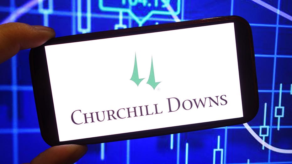 POLAND - 2025/02/02: In this photo illustration, the Churchill Downs Incorporated company logo is seen displayed on a smartphone screen. (Photo Illustration by Piotr Swat/SOPA Images/LightRocket via Getty Images)