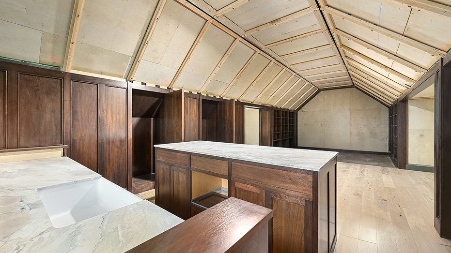 Above the garage is a screening room and bar area.
