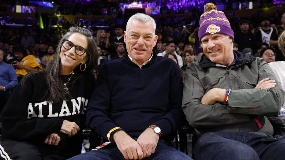 jami gertz, tony ressler and will farrell at hawks game