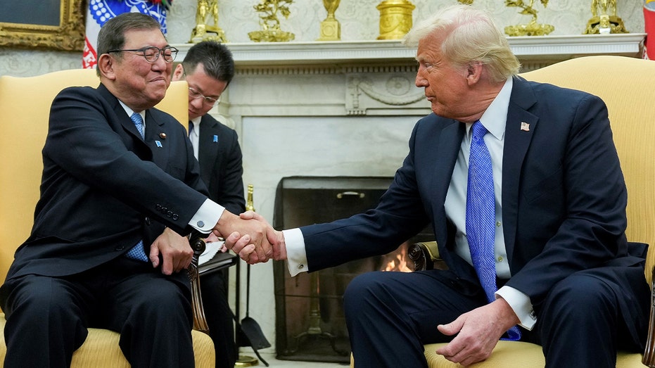 Japanese Prime Minister Shigeru Ishiba shakes hands with President Donald Trump at the White House