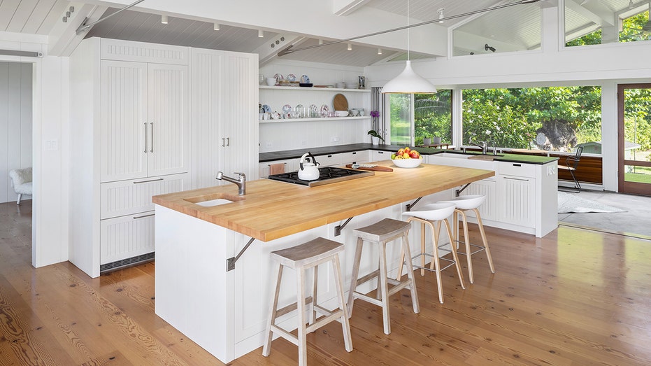 The kitchen boasts a large center eat-in island.