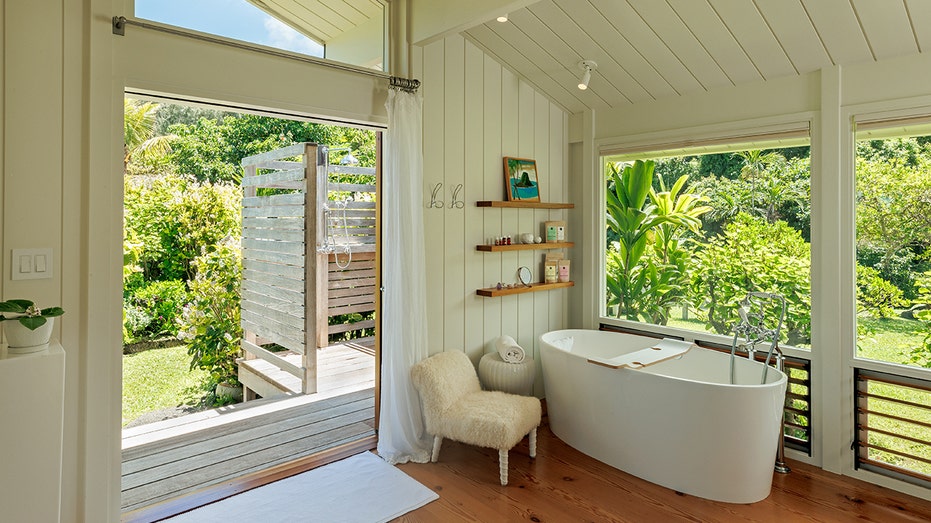 The ensuite bathroom also features an outdoor shower.