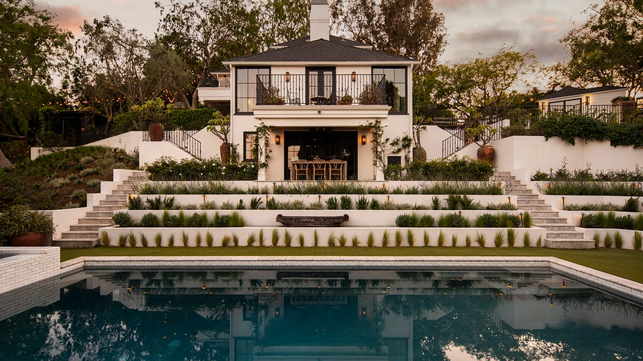 The tiered backyard also features a second outdoor dining area, as well as a sizable pool.