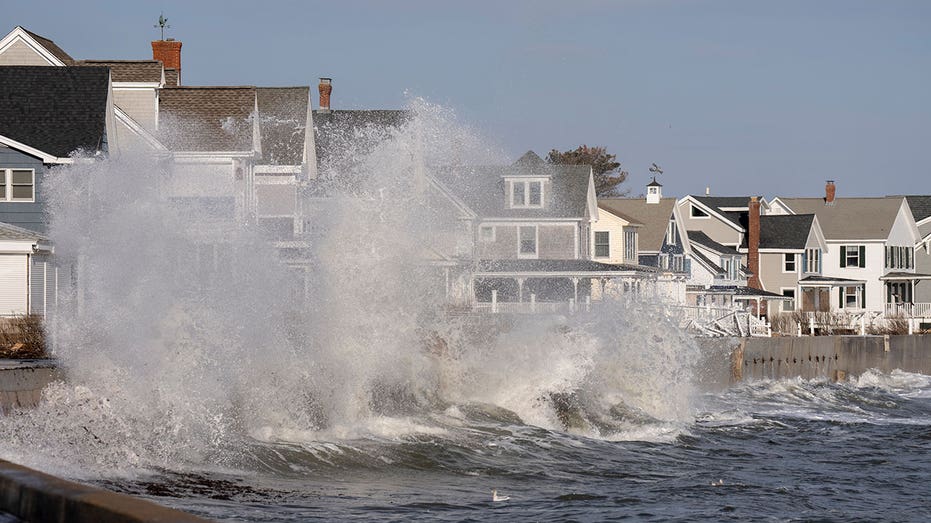 WELLS, ME DECEMBER 24: Waves break over a sea wall near houses in Wells on Saturday, December 24, 2022. (Staff photo by Gregory Rec/Portland Press Herald via Getty Images)