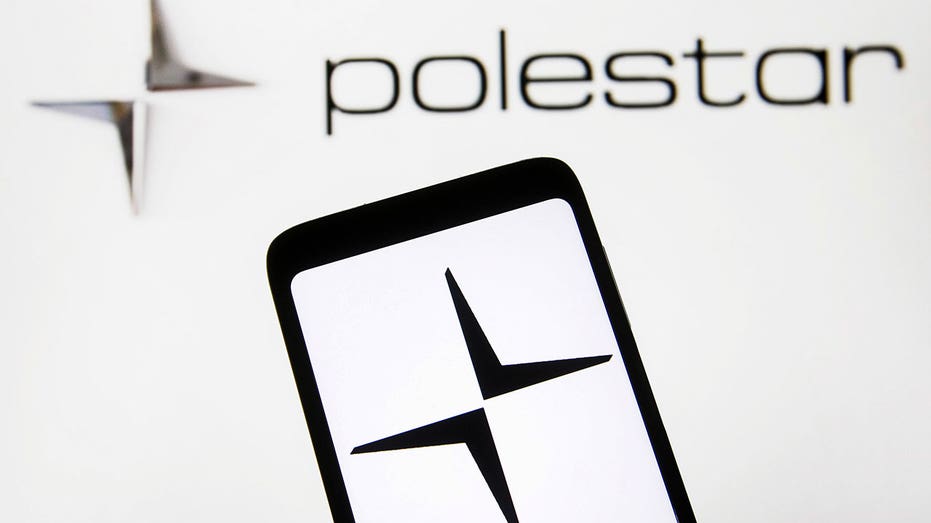UKRAINE - 2021/12/03: In this photo illustration, the logo of an automotive brand, Polestar AB is seen displayed on a smartphone and in the background. (Photo Illustration by Pavlo Gonchar/SOPA Images/LightRocket via Getty Images)